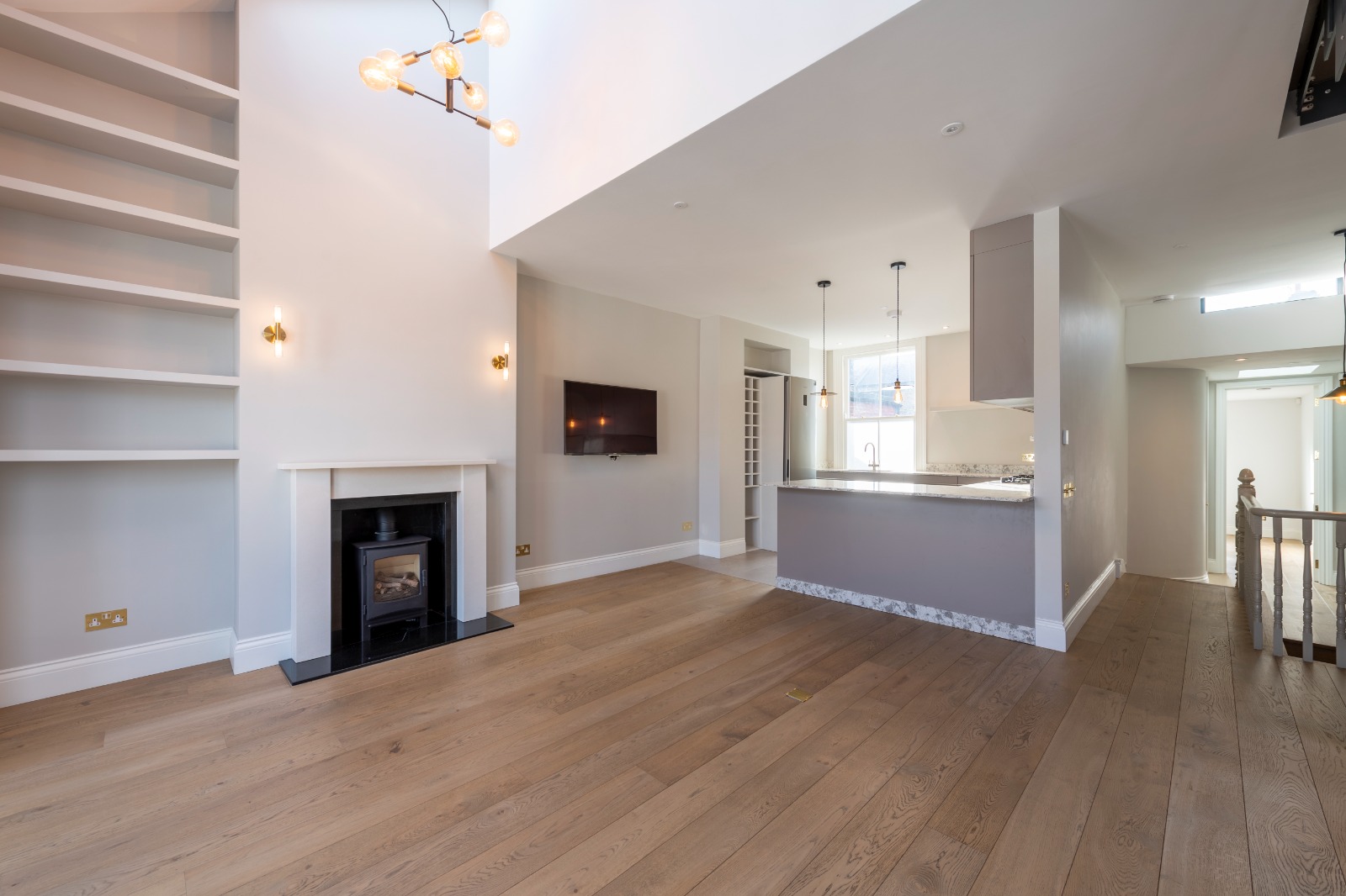 Burns Road — Bespoke alcove joinery framing the wood-burning stove.